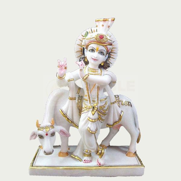 krishna statue with cow